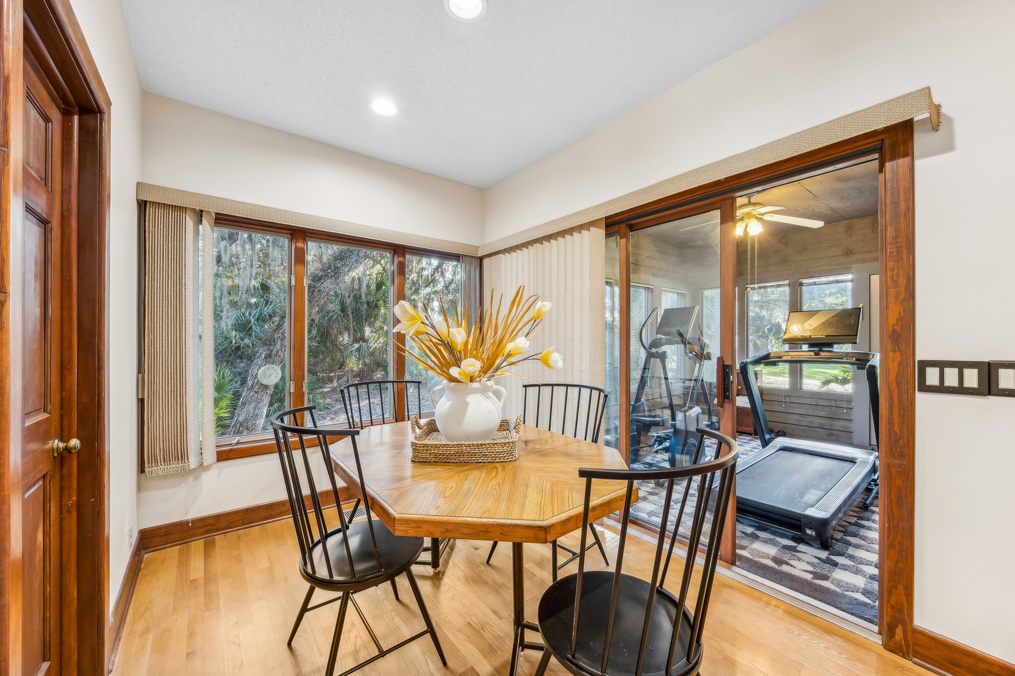 A light-filled breakfast nook connects to the kitchen, with peaceful views ...