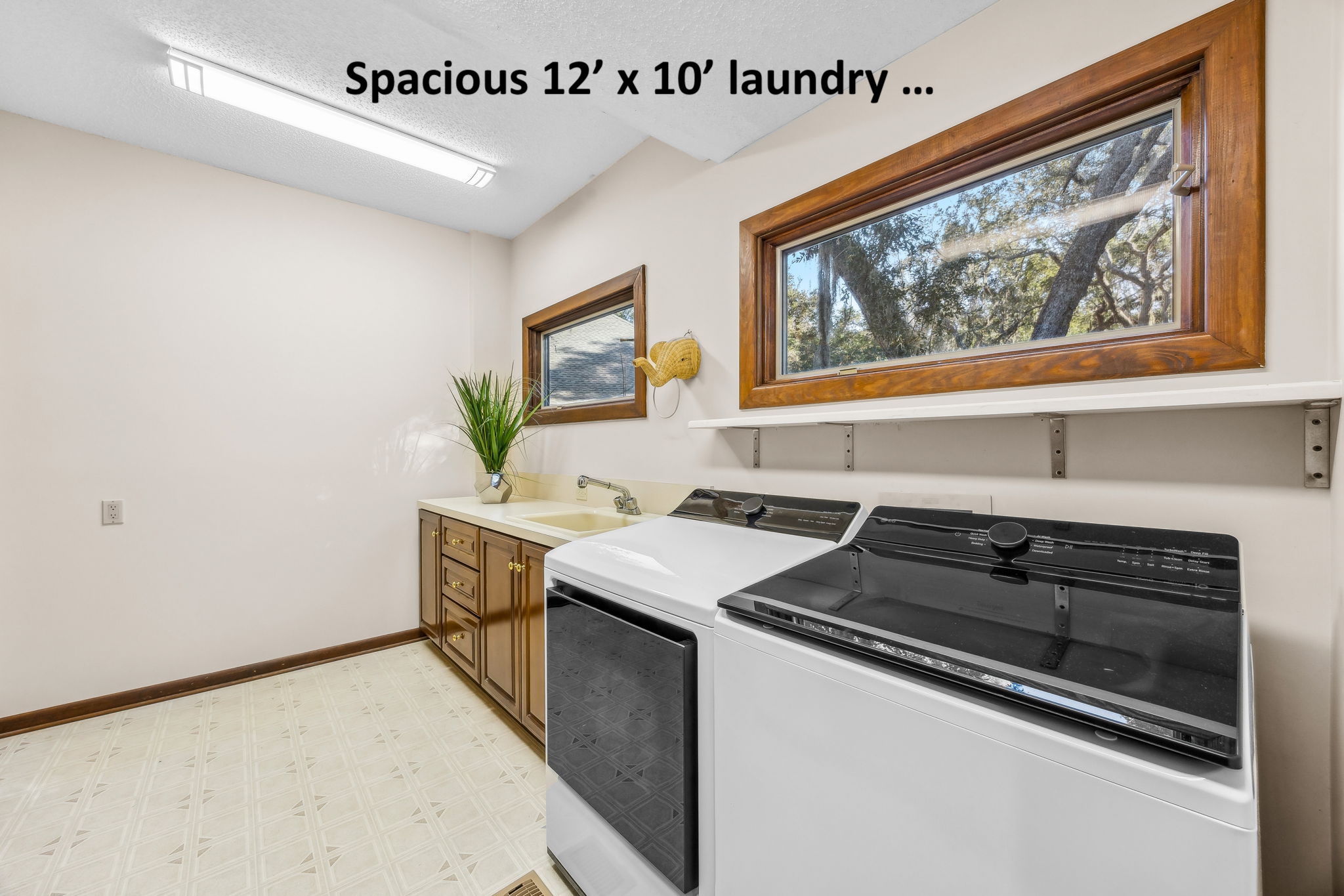 An oversized laundry room adjacent to the kitchen ...