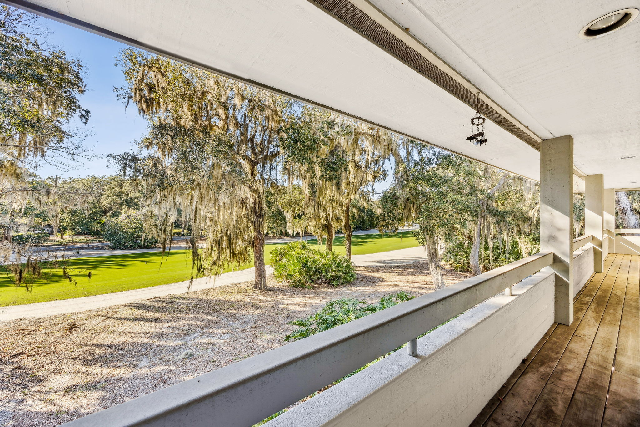 A balcony spans the length of the home ...