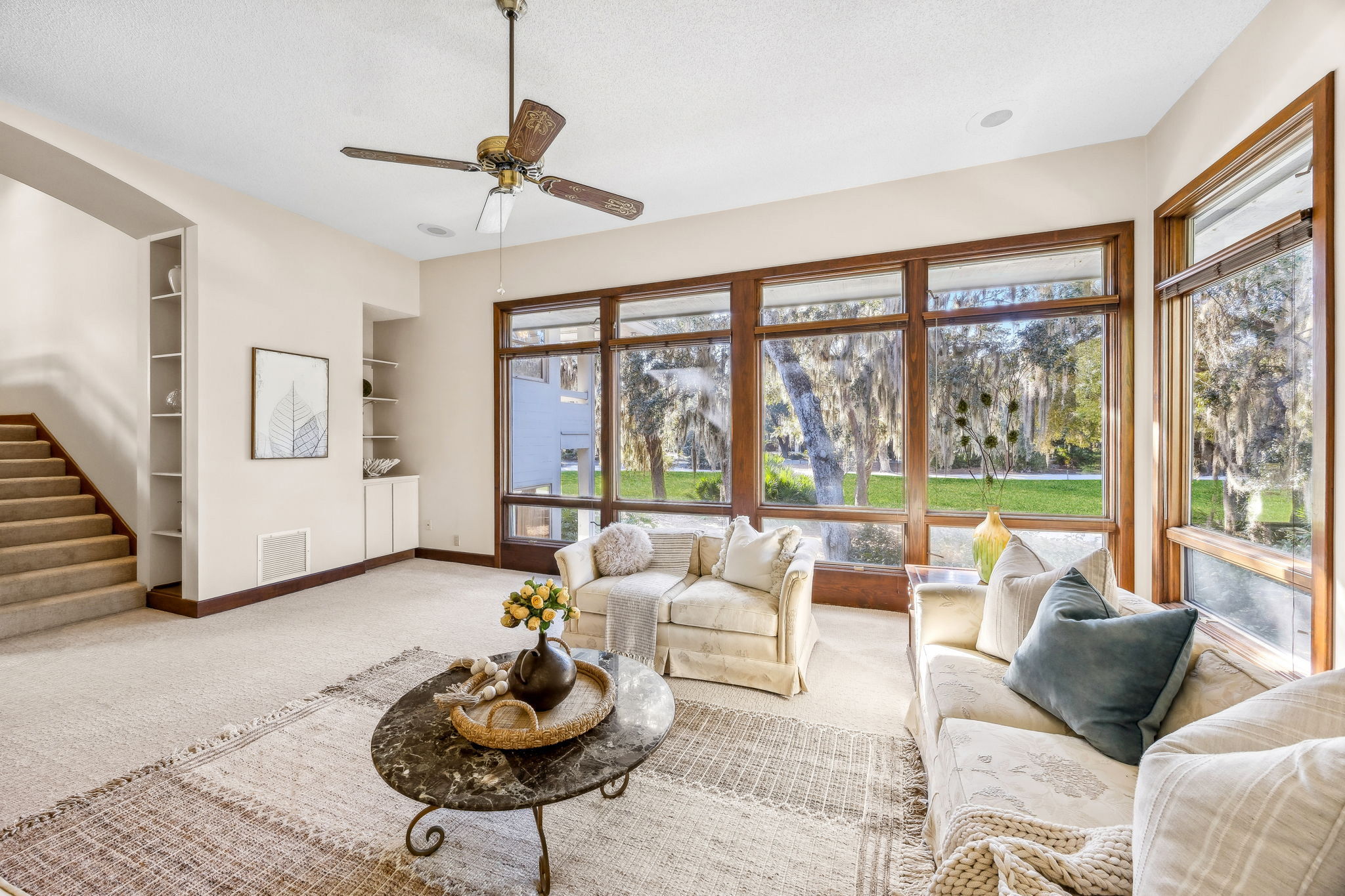 ... featuring 11-foot ceilings and an architectural wall of near floor-to-ceiling windows