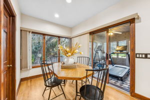 A light-filled breakfast nook connects to the kitchen, with peaceful views ...