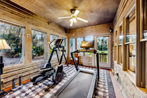 ... and with access to an enclosed sunroom currently utilized as a private gym.