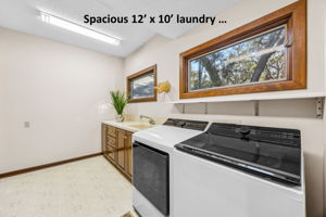 An oversized laundry room adjacent to the kitchen ...
