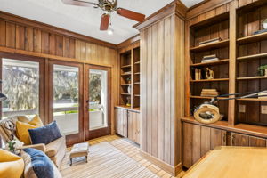 A private, light-filled office within the primary suite captures scenic views.