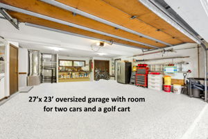 The recently epoxied garage accommodate two cars and a golf cart.