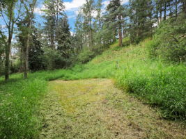 Flat areas on both sides of the gulch.