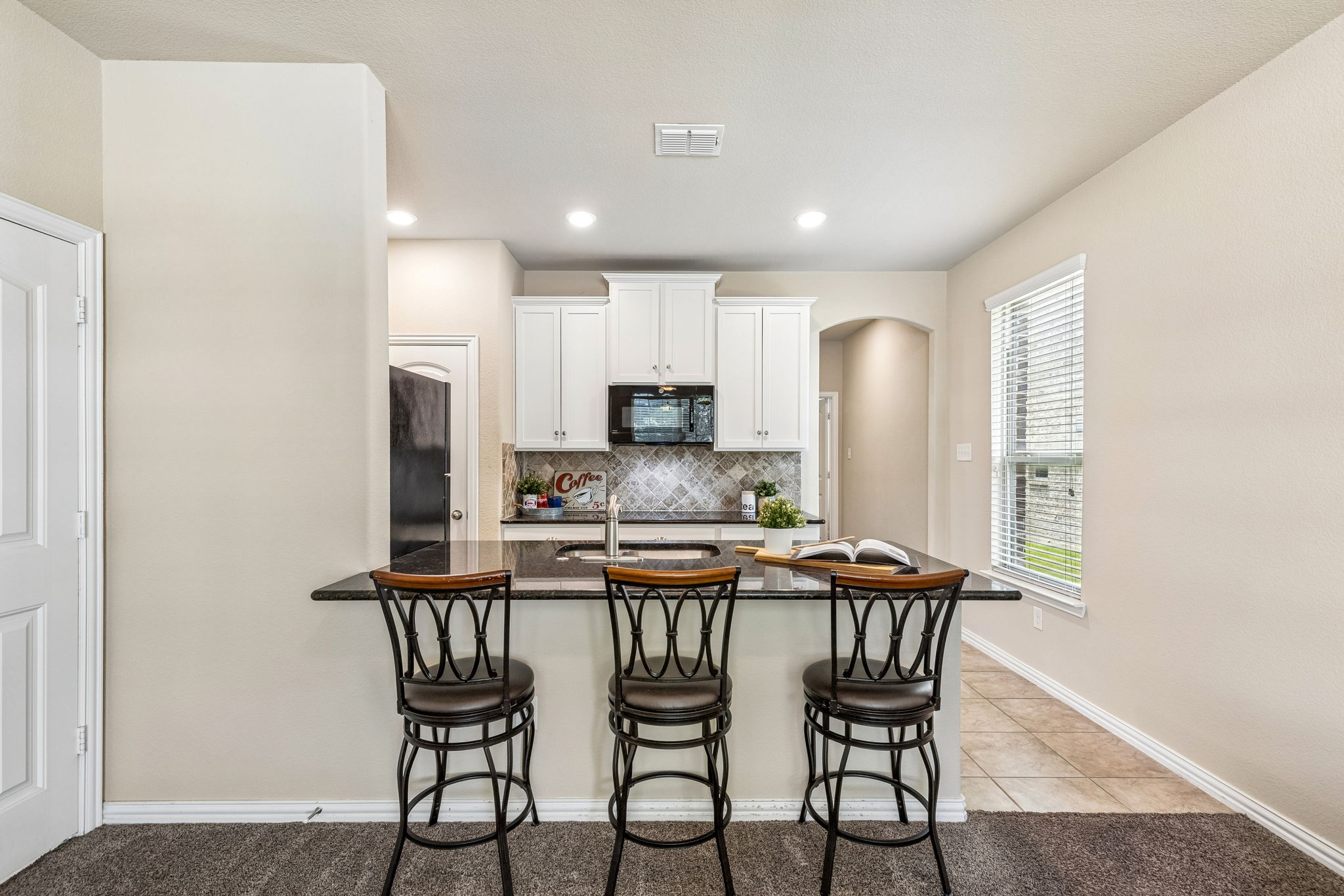Separate Mother-In-Law Apartment with kitchenette, laundry, one bedroom, and a full bathroom