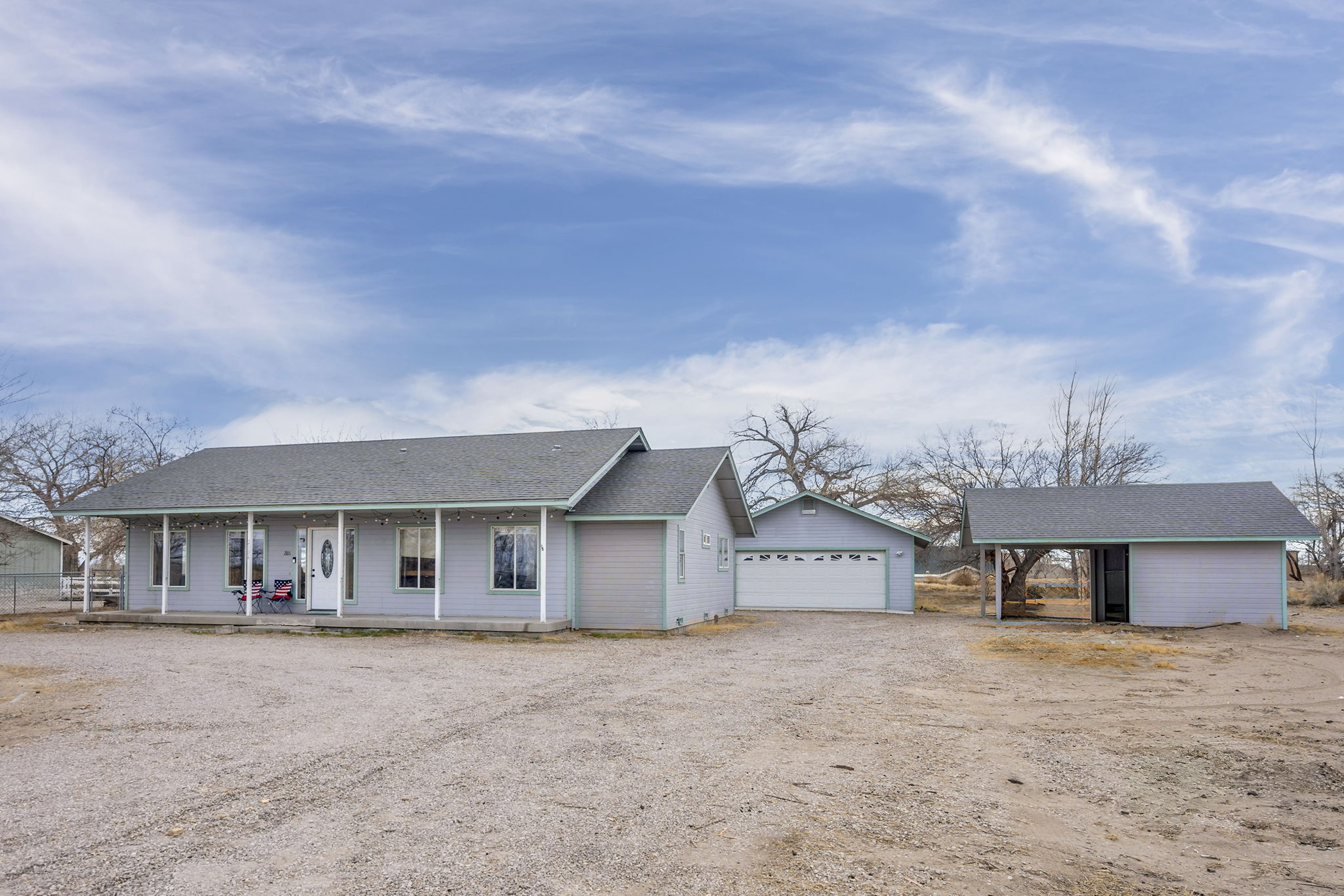 Front View: Garage and Covered Carport
