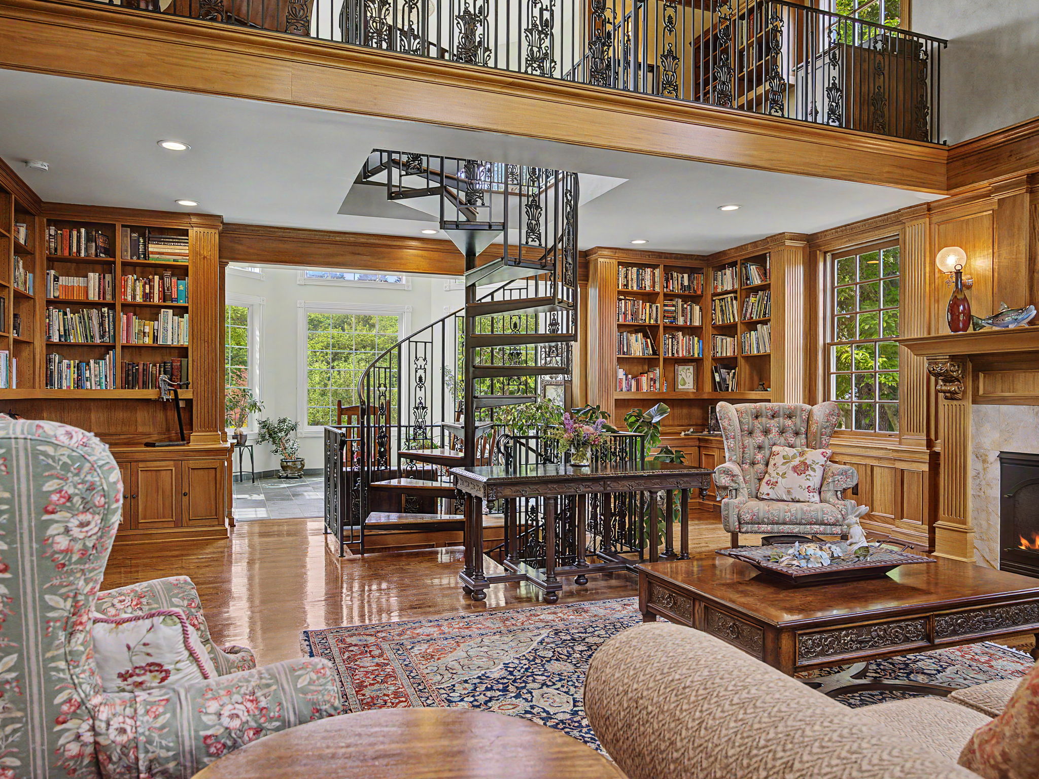 Main floor Library room - fireplace & Circular Staircase Up & Down