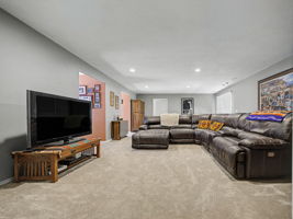 Great room has two Window dormer seats, carpeting