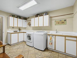 Laundry - Main floor - has built in sink, ironing board