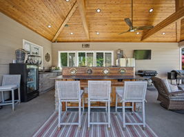 Outdoor Kitchen has Marine wood, brass port holes