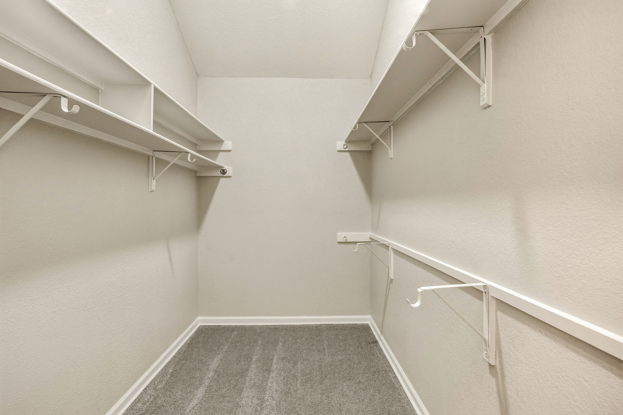 Large Walk-in Master Closet with New Carpet