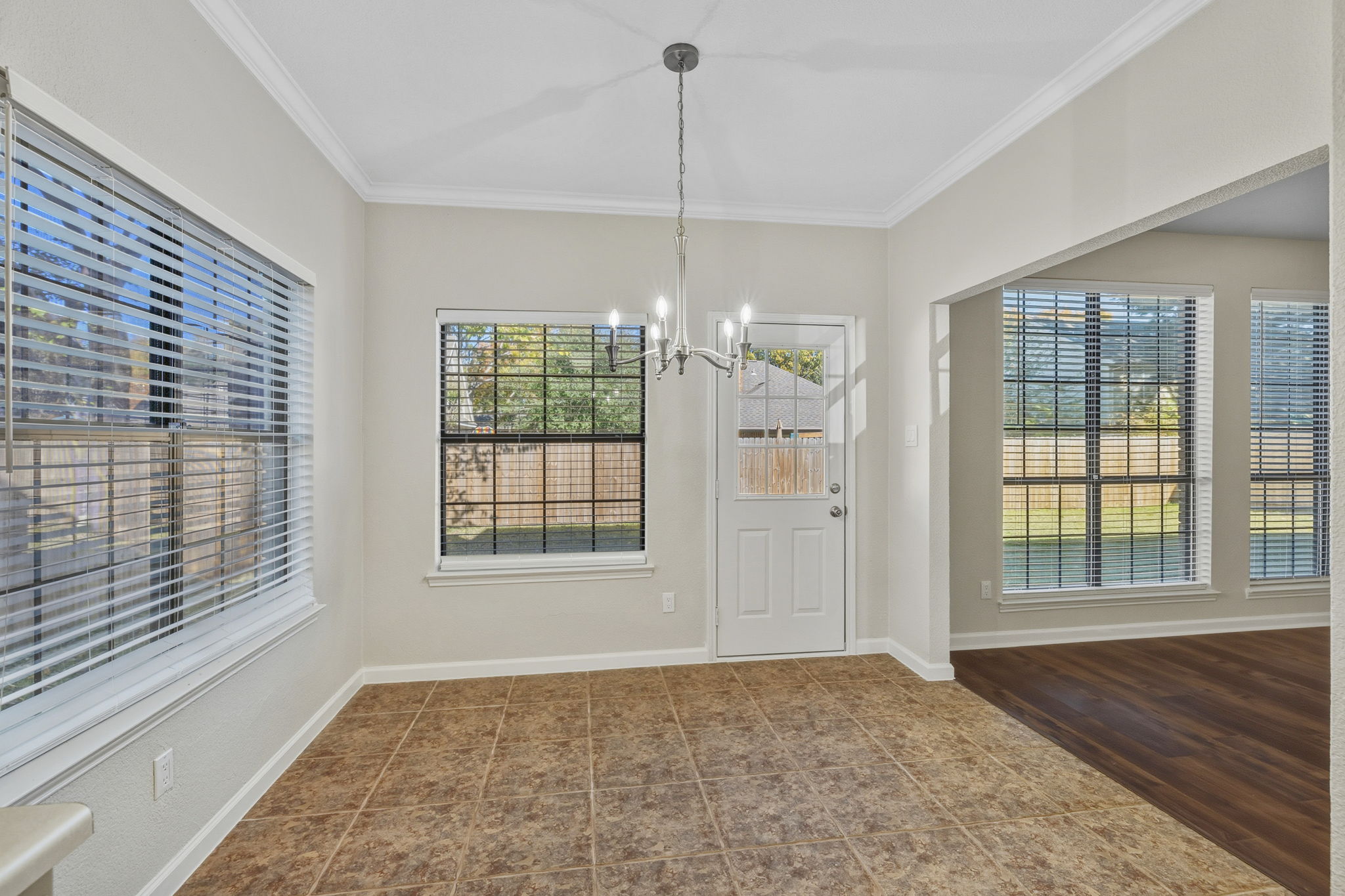 Kitchen Dining Area, New Lighting and Lots of Natural Light from Windows with 2" Blinds & Solar Screens