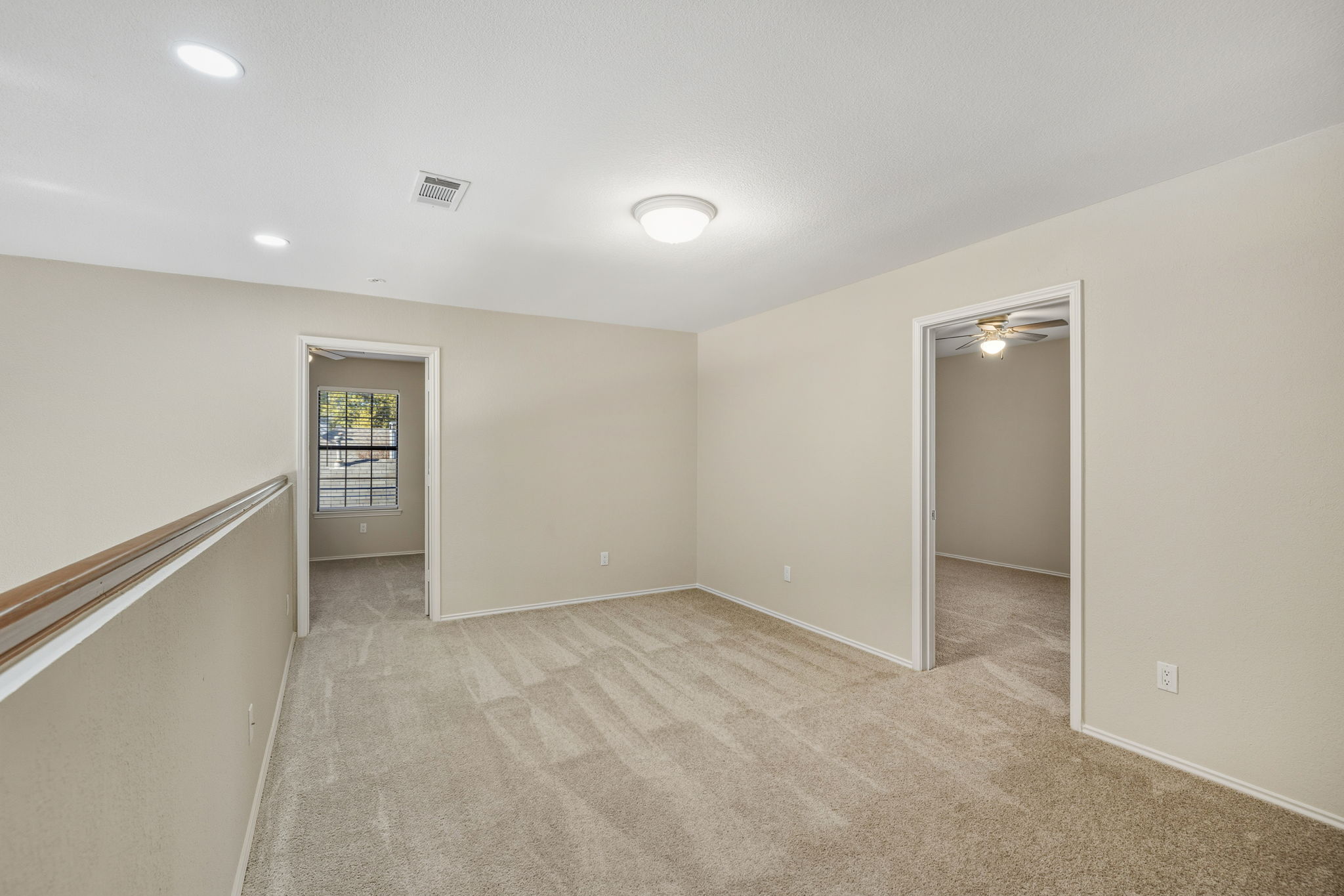 Versatile upstairs third living area—ideal as a game room, media space, or study—adjacent to two bedrooms.