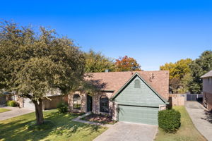 From the Street Looks like a 1 story home - Inside with soaring 18' ceilings with large upper level living space & 3 more bedrooms