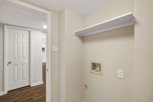 Laundry Near Garage Entrance and Understairs Storage