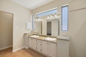 Master Bathroom with Double Sink Granite Countertop Vanity, Tiled Floor and Rain-Glass Windows
