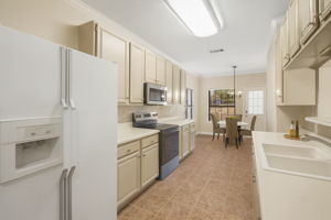 Kitchen Virtually Staged Light-filled kitchen with extensive prep space, refreshed cabinetry, and a cozy breakfast dining area—ideal for both daily living and hosting.