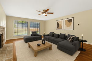 Virtually staged family room illustrating the scale and flow of the space with luxury waterproof flooring throughout.