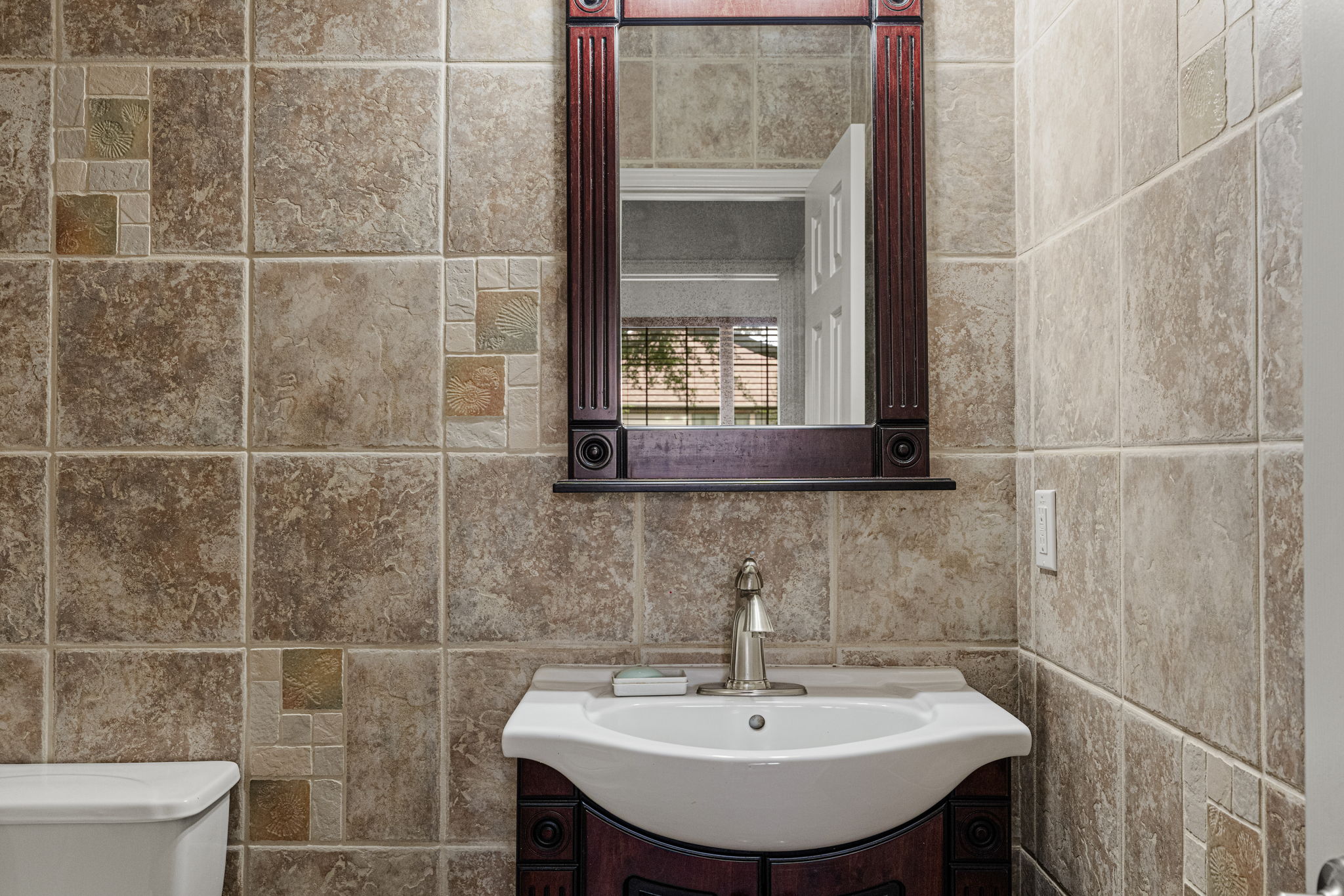 Downstairs half bath that could easily be converted to a full bath!