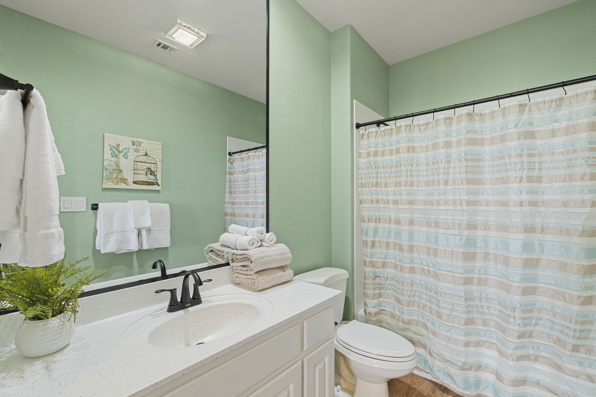 En-suite bath for guest bedroom upstairs.
