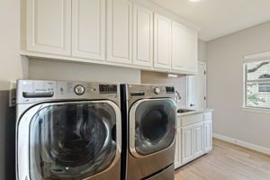 Laundry Room with extra storage closet