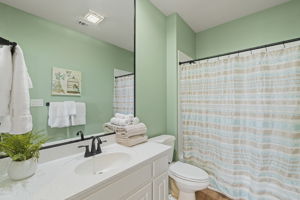 En-suite bath for guest bedroom upstairs.