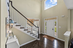 Elegant Foyer with Sweeping Staircase