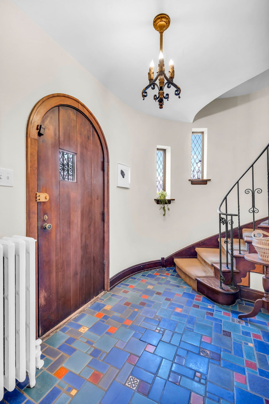 Welcoming foyer with spectacular original tile floor