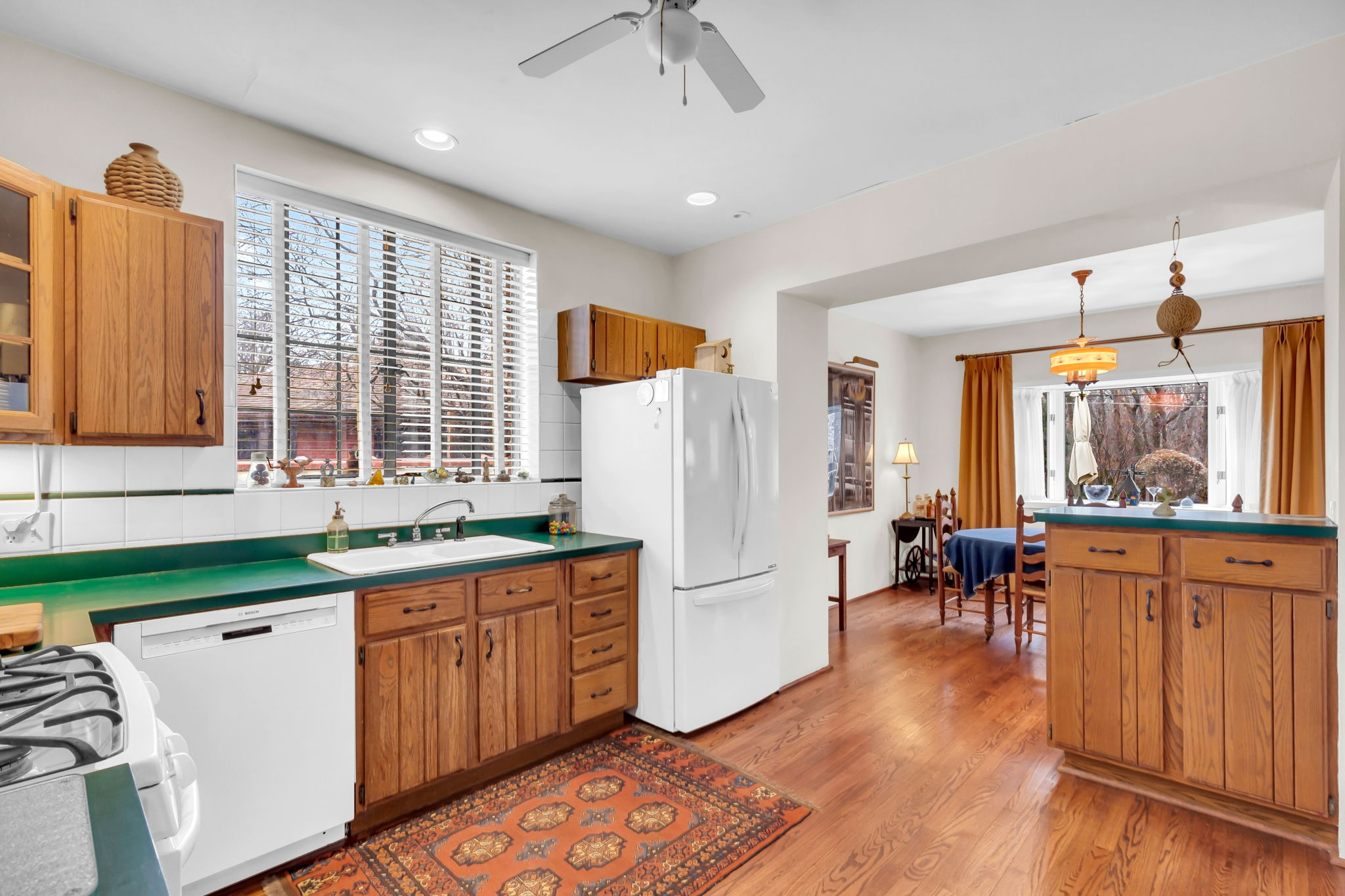 Pleasant kitchen with Irish green countertops and ample cabinets