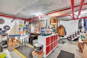 Full unfinished basement with laundry and tons of storage space