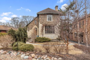 Additional features include: attached garage, brick paver driveway, copper gutters, Ludowici tile roof