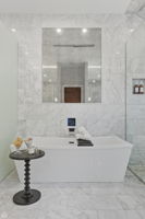 Soaking tub with integrated vintage mirror