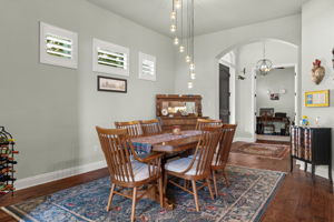 Dining room w/ decorative chandelier