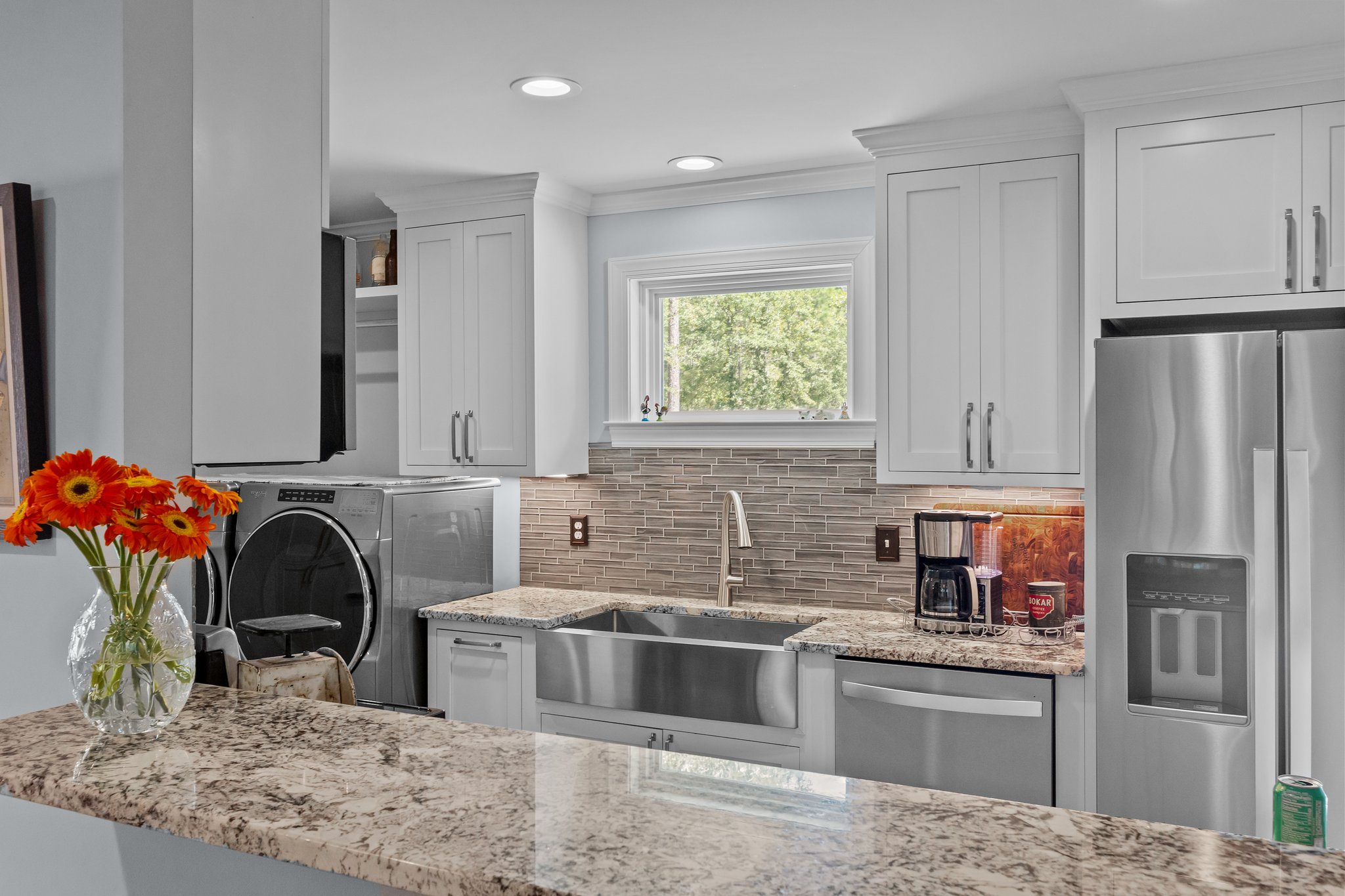 Guest house kitchen with laundry