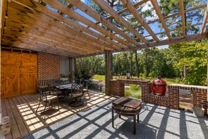 Guest house entertaining area with grill and pizza oven