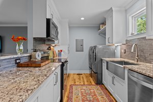 Guest house kitchen with laundry