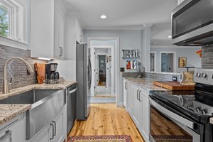 Guest house kitchen with laundry