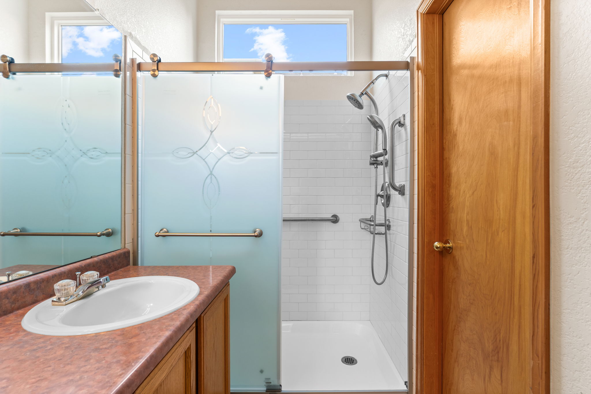 Primary bathroom with remodeled shower