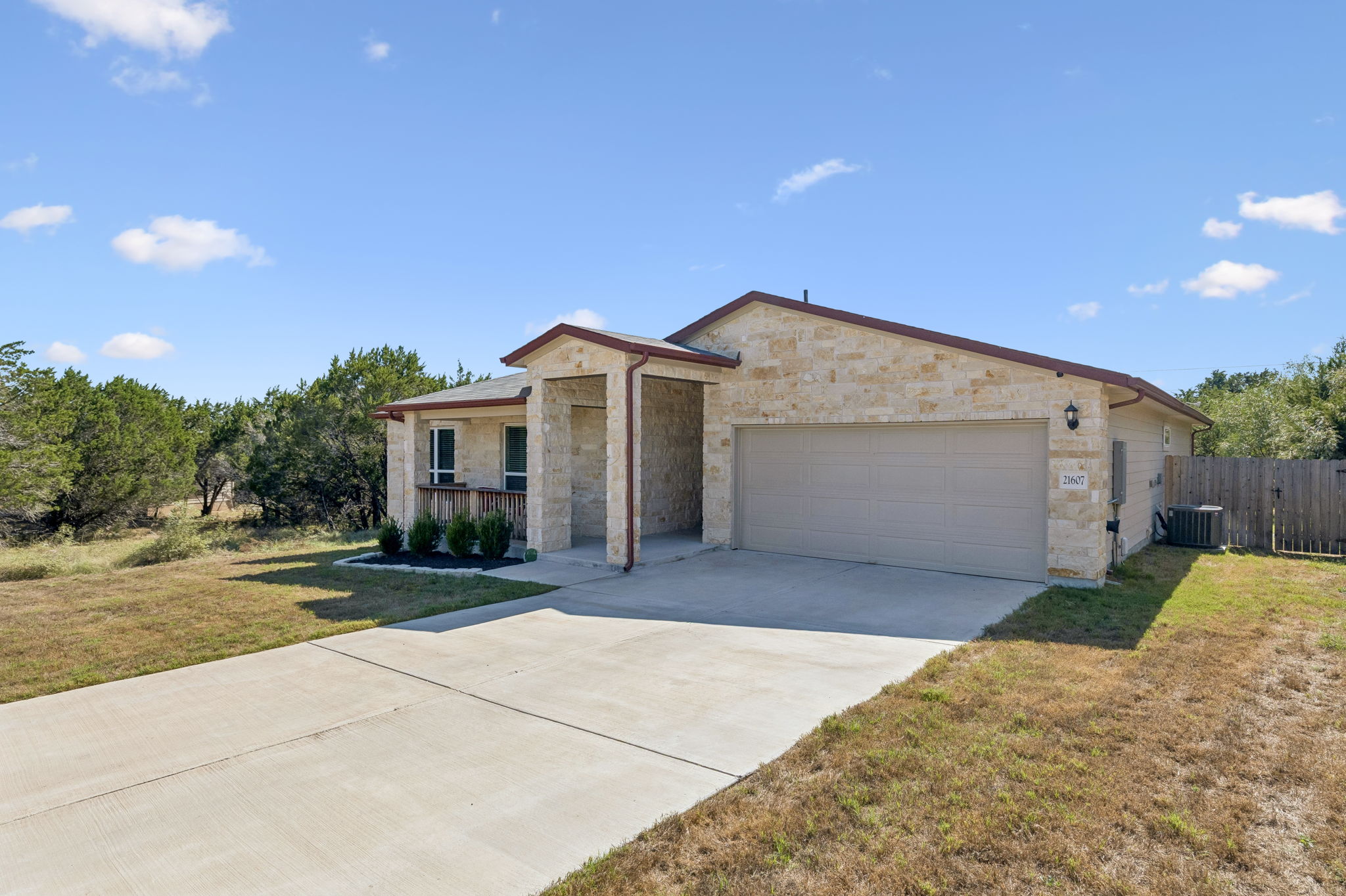 Attached two-car garage with driveway parking