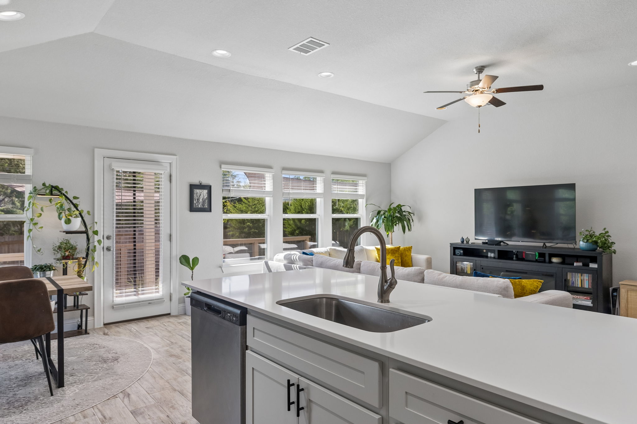 Open kitchen with island storage and dishwasher