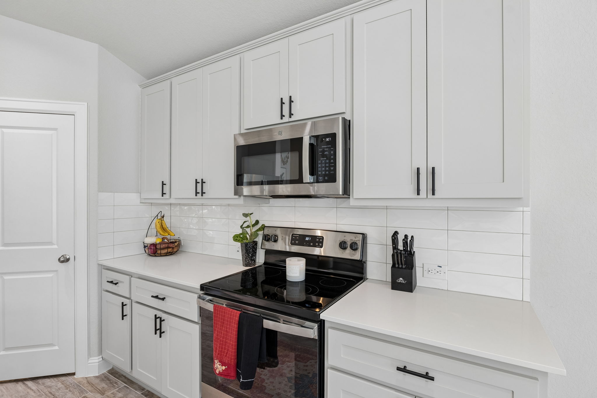 Electric range, microwave, and generous cabinet storage