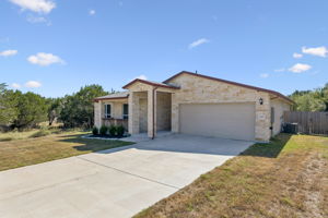 Attached two-car garage with driveway parking