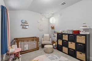 Bedroom currently arranged as a nursery