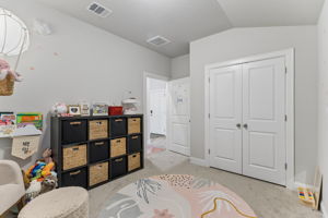 Bedroom with double-door closet