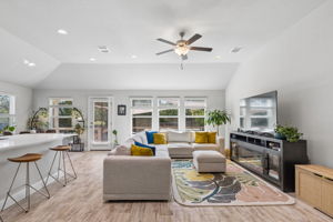 Living area with recessed lighting and ceiling fan