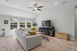 Spacious living room with high ceilings and natural ligh