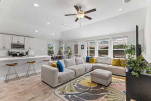 Connected kitchen, dining, and living areas for entertaining