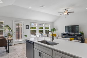 Open kitchen with island storage and dishwasher